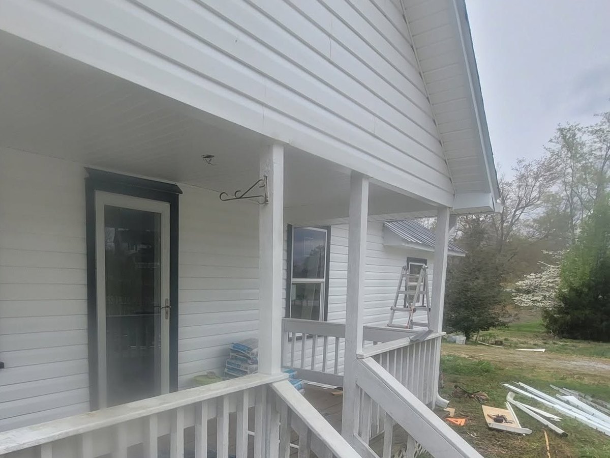 Porch roofline, soffit and gable from below by Robinson Roofing, Elon