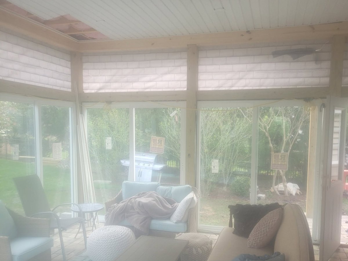 A finished sunroom under its new ceiling by Robinson Roofing, Elon