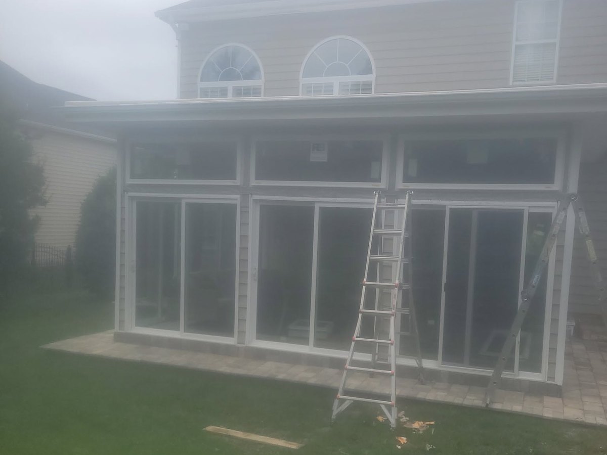 Rear elevation, gutter line and enclosed porch by Robinson Roofing, Elon